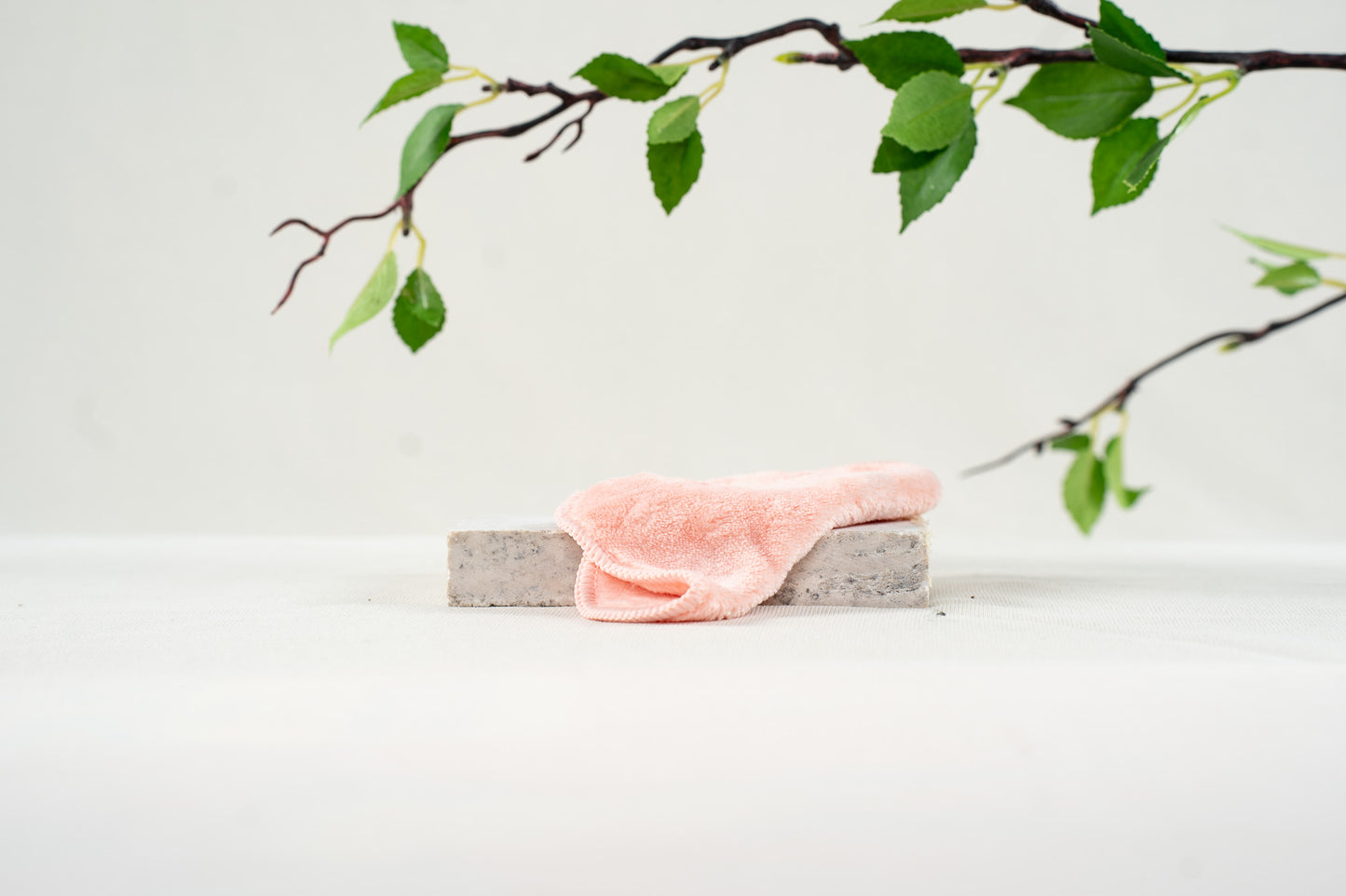 5x5 coral colored, fluffy microfiber face cloth folded in half | Pure Blossom Skin