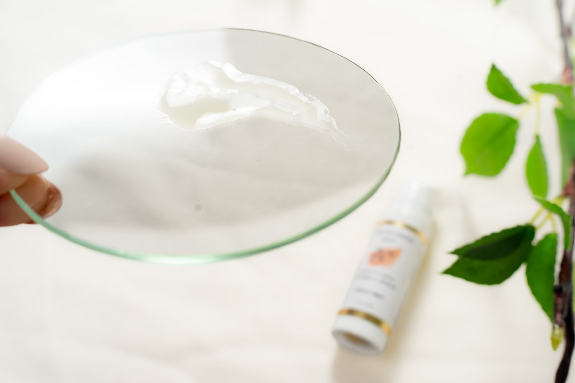 Close up of glass dish with dab of clear VITAMIN C SERUM on it | Pure Blossom Skin